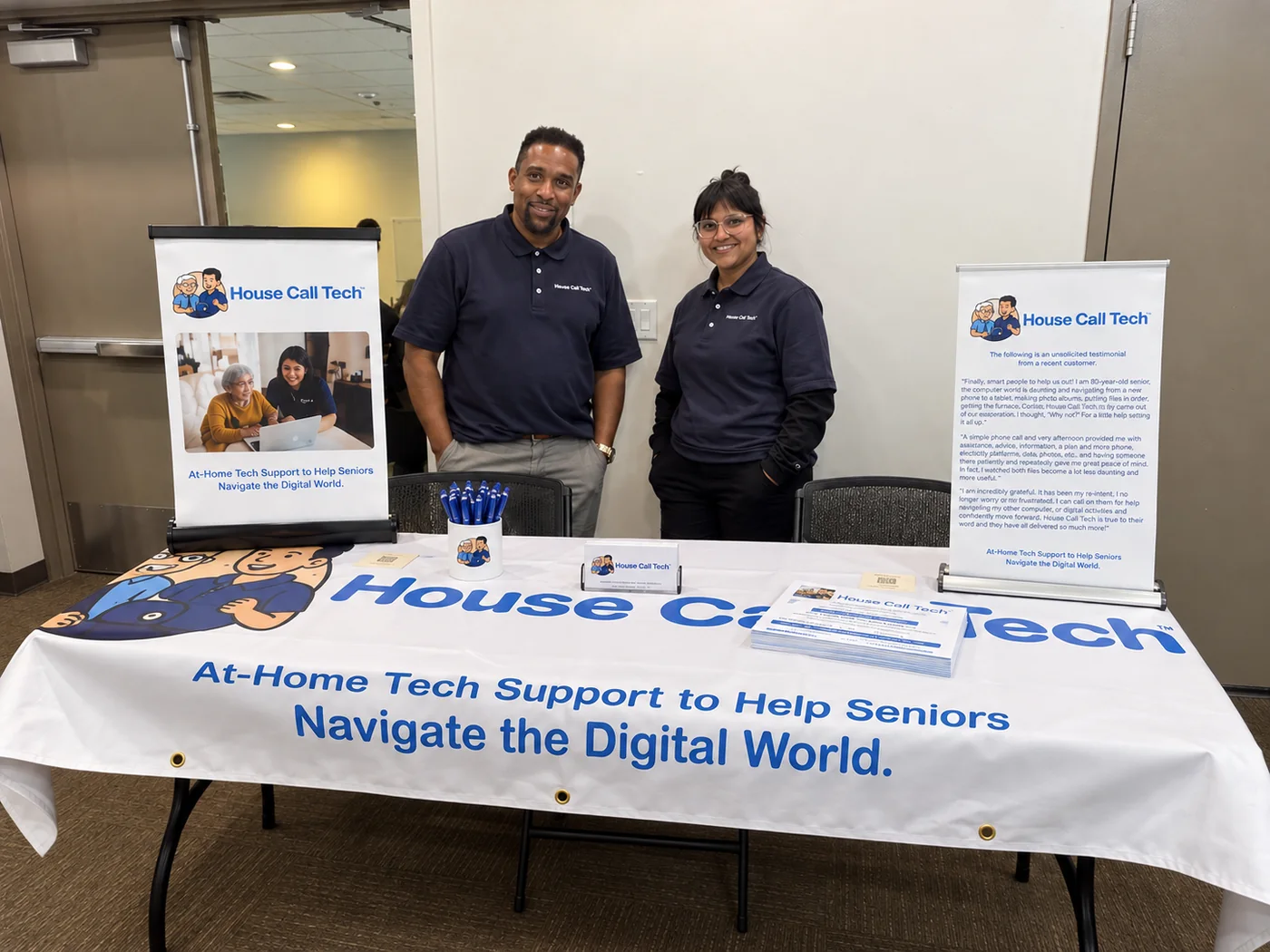 House Call Tech technicians at the House Call Tech table at the Digital Discovery Fair