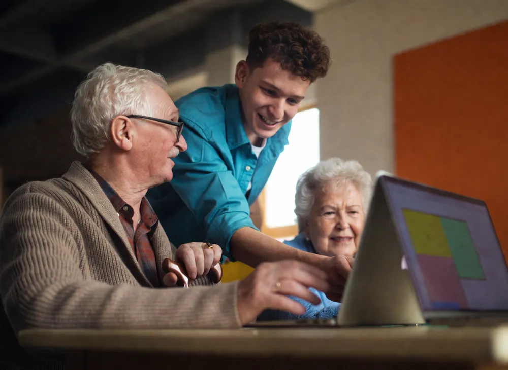Technician providing at-home computer help to a senior in Northern Virginia
